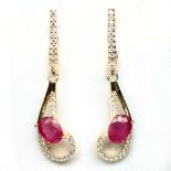 A pair of 925 silver gilt drop earrings set with oval cut rubies and white stones, L. 3.6cm.