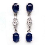 A pair of 925 silver drop earrings set with cabochon cut sapphires and white stones, L. 3cm.