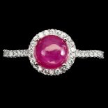 A 925 silver cluster ring set with a cabochon cut ruby and white stones, (P).