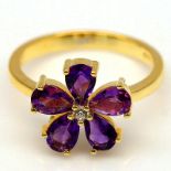 A pair of 925 silver gilt flower shaped rings et with amethyts, (P.5).