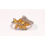 A 925 silver ring set with marquise cut fancy yellow sapphires and white stones, (N).