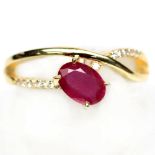 A matching 925 silver gilt ring set with oval cut ruby and white stones, (L).
