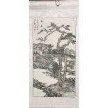 A Chinese painted watercolour mounted on a silk scroll of a river landscape with two trees in the