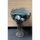 An unusual vintage concrete pedestal planter decorated with badgers, H. 72cm.