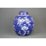 A large 19th/20th century Chinese hand painted 'Prunus' pattern porcelain jar and lid, H. 27cm.
