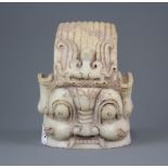 An interesting Chinese carved marble guardian deity head, H. 15cm. Dia. 11.5cm.