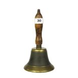 An oak and brass school bell, H. 24cm.