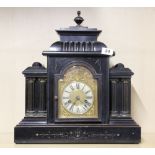 A Victorian ebonized wooden mantel clock with gilt brass dial, H. 47cm. W. 43cm.