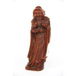 A Chinese carved horn figure of a deity, H. 18cm.