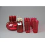 A Victorian cranberry glass jug, sugar shaker and eight beakers.