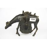 An early 20th C Chinese bronze figure of a horse with detachable saddle, H. 17cm. Left ear missing