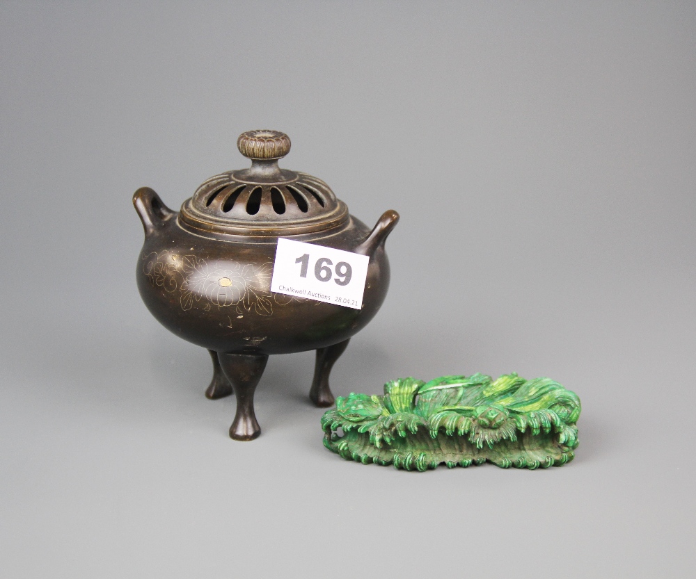 A Chinese bronze censer, H. 12cm. Together with a green dyed early 20th century carved ivory stand.