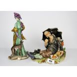 A Naples porcelain figure of a tramp together with a further Naples porcelain figure of a young