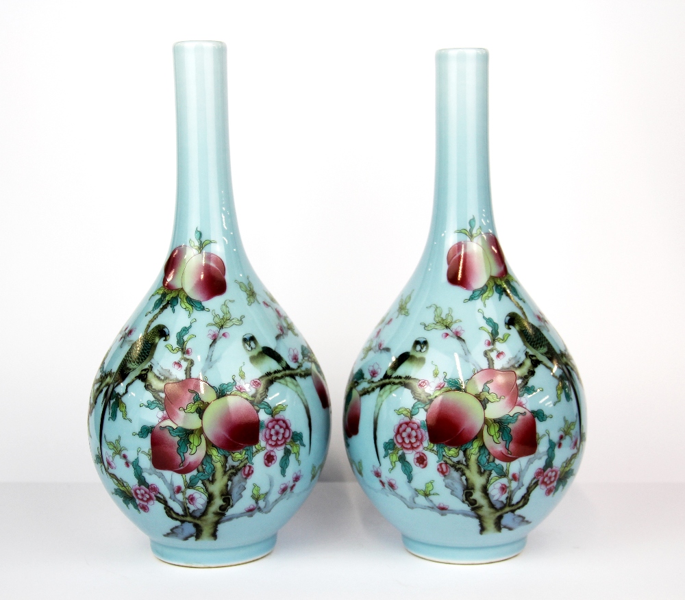 A pair of Chinese hand decorated porcelain vases, H. 28cm.