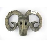 A Chinese patinated bronze goat's skull and horns, W. 14cm.