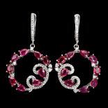 A pair of 925 silver drop earrings set with oval and pear cut rubies and white stones, L. 4cm.