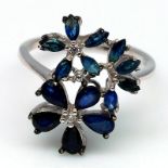 A 925 silver ring set with pear and marquise cut sapphires and white stones, (Q).