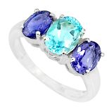 A 925 silver ring set with oval cut blue topaz and iolites, (Q.5).