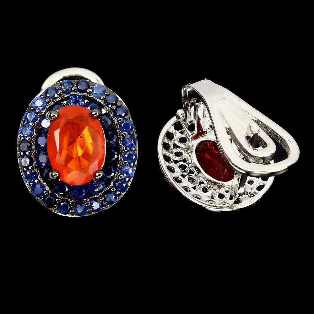 A pair of 925 silver earrings set with an oval cut fire opal and two rows of sapphires, L. 1.2cm. - Image 2 of 2