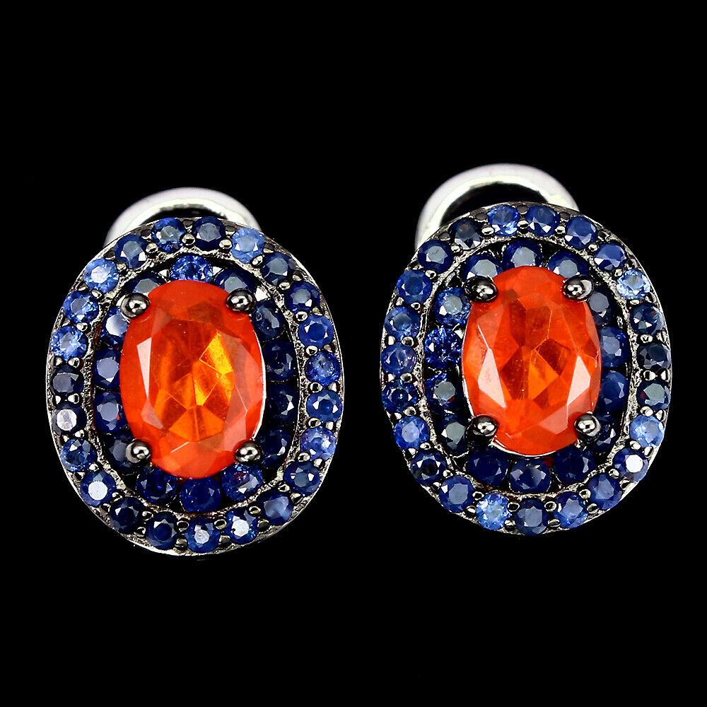 A pair of 925 silver earrings set with an oval cut fire opal and two rows of sapphires, L. 1.2cm.