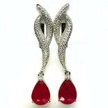 A pair of 925 silver drop earings set with pear cut rubies and white stones, L. 4.5cm.
