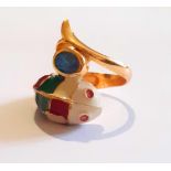 A 925 silver gilt enamelled fish shaped ring, set with oval cut sapphire and ruby eyes, (P).