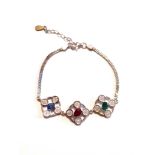 A 925 silver bracelet set with emerald, ruby and sapphire, L. 17cm.