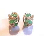 A pair of 925 silver earrings set with emeralds and white stones, L. 1cm.