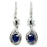 A pair of 925 silver drop earrings set with oval cut sapphires and white stones, L. 3.3cm.