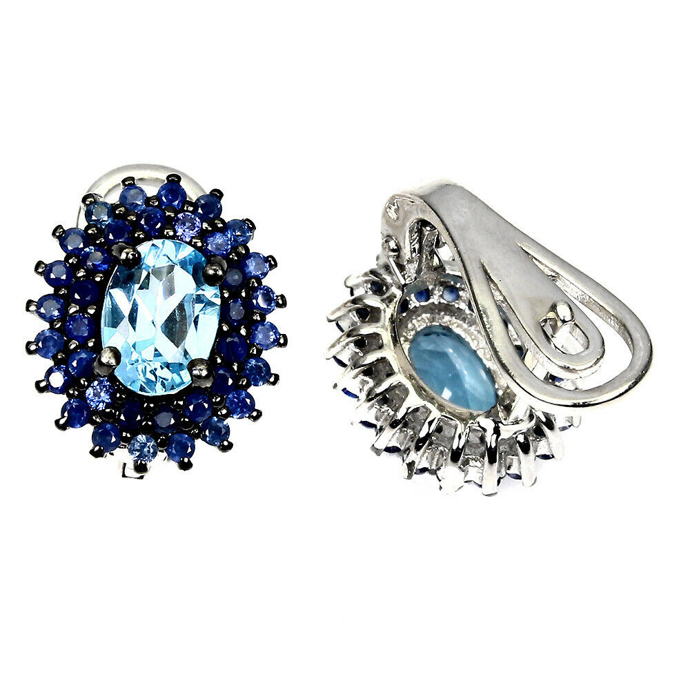 A pair of 925 silver earrings set with an oval cut blue topaz and two rows of sapphires, L. 1.7cm. - Image 2 of 2