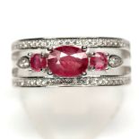 A 925 silver ring set with oval cut rubies and white stones, (Q).