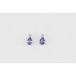 A pair of 9ct white gold stud earrings set with pear cut tanzanites and diamonds, L. 0.7cm.