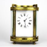 An oval brass carriage clock, H. 12cm.