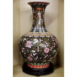 An impressive 19th / early 20th century Chinese porcelain vase with famille noire decoration and a