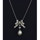 A 950 platinum bow shaped necklace set with a freshwater pearl and old cut diamonds, L. 41cm, in