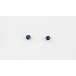 A pair of 9ct white gold sapphire set stud earrings, Dia. 0.4cm.