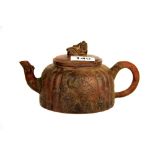 A Chinese Yixing terracotta teapot, H. 10cm, L. 20cm.