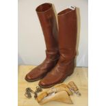A pair of vintage men's (understood to be size 9)leather riding boots with wooden trees by Peale