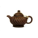 A Chinese Yixing terracotta teapot, H. 11cm, spout to handle 18cm.