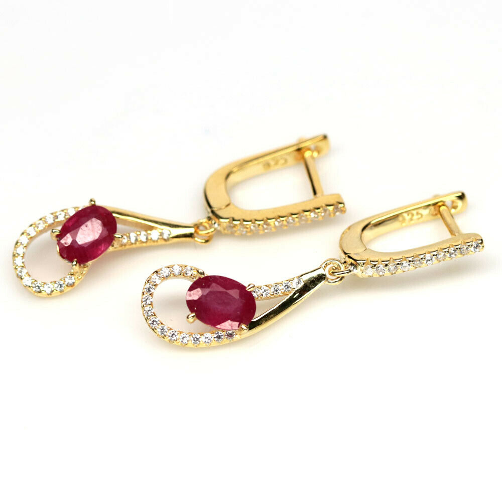 A pair of 925 silver gilt drop earrings set with oval cut rubies and white stones, L. 3.6cm. - Image 2 of 2