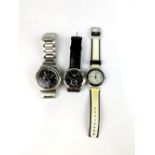 Two Swatch watches and a Citizen watch.