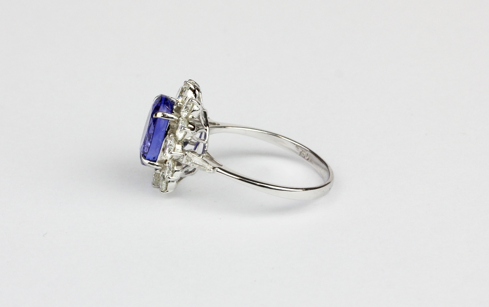 An 18ct white gold (stamped 750) cluster ring set with an oval cut tanzanite surrounded by brilliant - Image 2 of 2