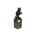 A bronze figure of an owl on a marble base, H. 28cm.