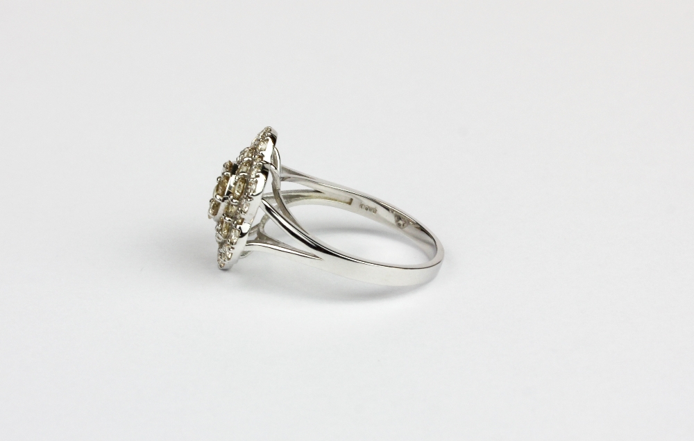 A 18ct white gold (stamped k18) flower shaped cluster ring set with brilliant cut diamonds, - Image 2 of 2