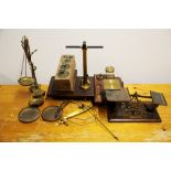 A quantity of weighing scales and weights.