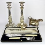 A pair of large silver plated candlesticks, H. 27cm., together with a silver sauce boat and other