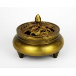 A Chinese gilt bronze censer with pierced lid depicting Mandarin ducks on a pond among lotus, Dia.