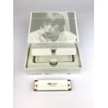 The Hohner Imagine John Lennon signature series harmonica.