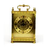 A vintage brass Estyma carriage style mantle clock with Quartz movement, H. 22cm. Understood to be