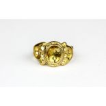 A yellow metal (tested high carat gold) antique ring set with an oval cut citrine, (O).